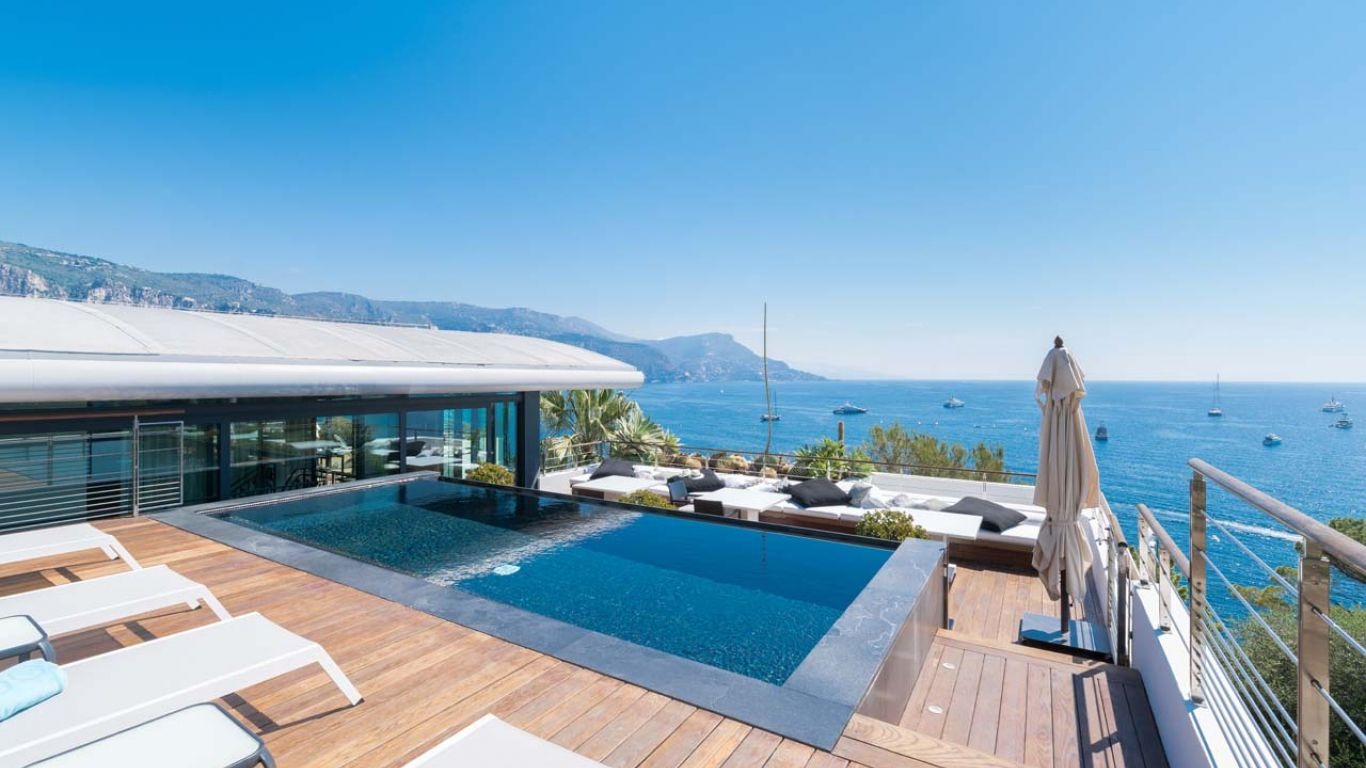 A private oceanfront villa and pool.